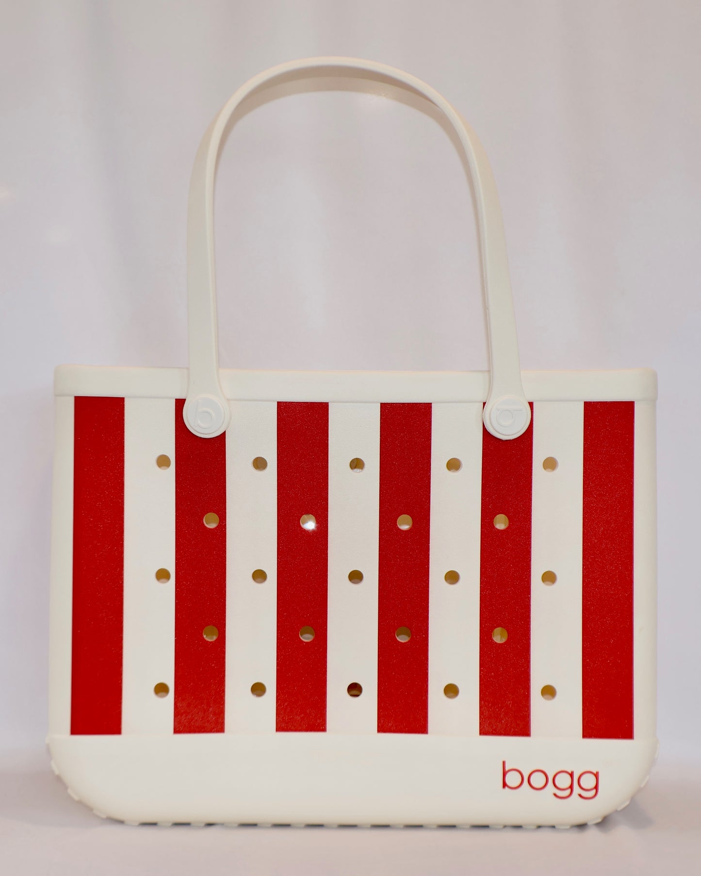 Tote bag with red stripes and gold polka dots on a white background