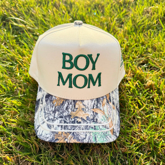 Cap with 'BOY MOM' text on grass