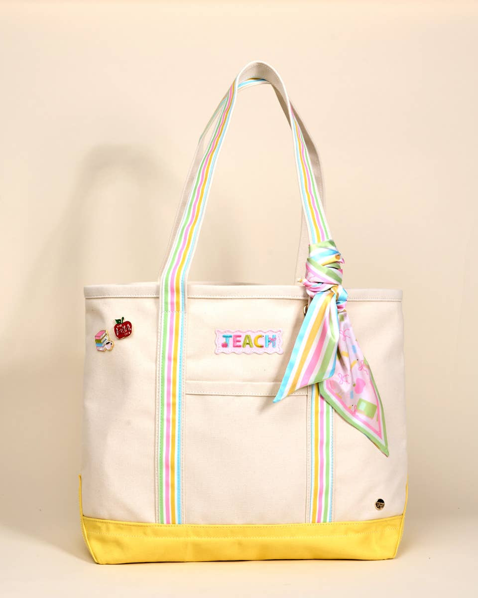 Beige tote bag with colorful accents and 'TEACH' embroidery on a beige background