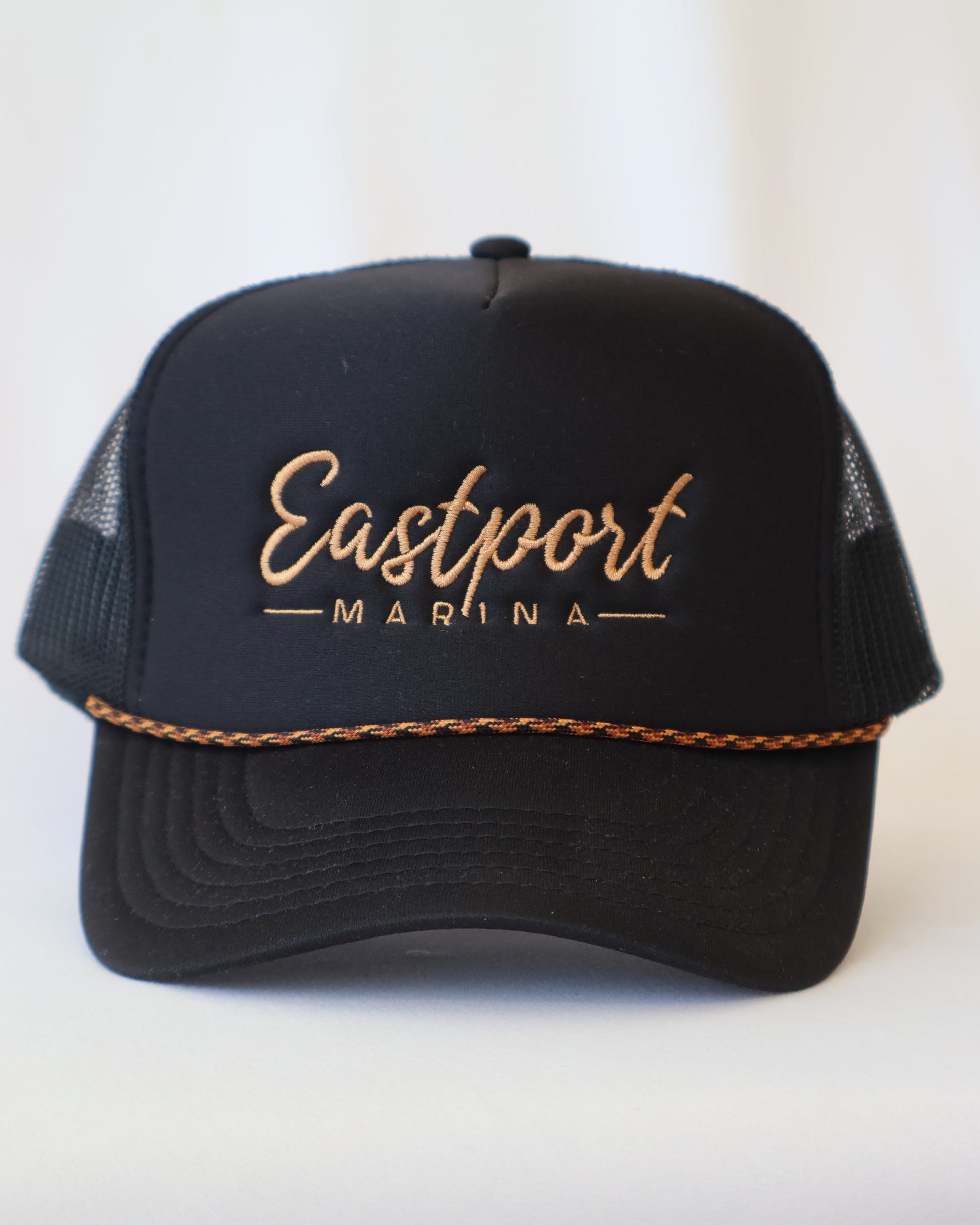 Black cap with 'Eastport Marina' text on a white background