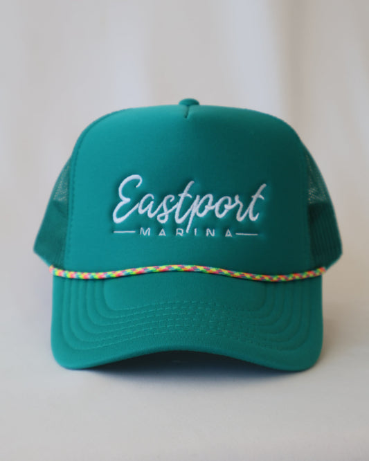 Green cap with 'Eastport marina' branding on a white background