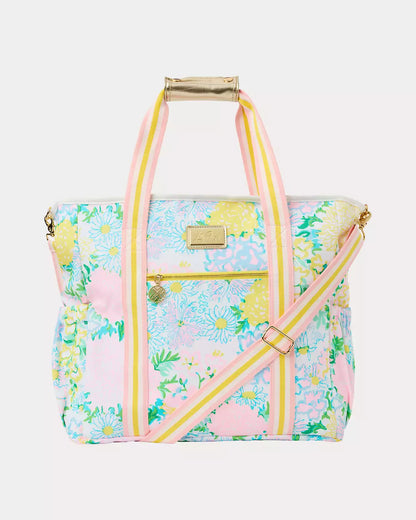 Floral patterned bag with pink straps on a white background