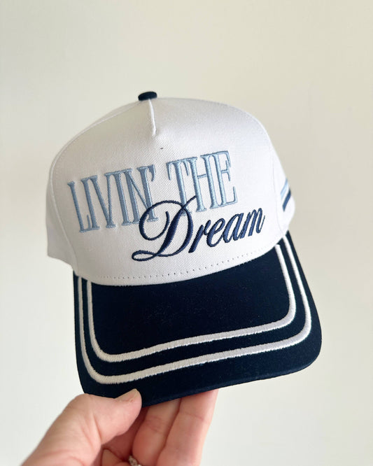 Cap with 'Livin' The Dream' text on a white background